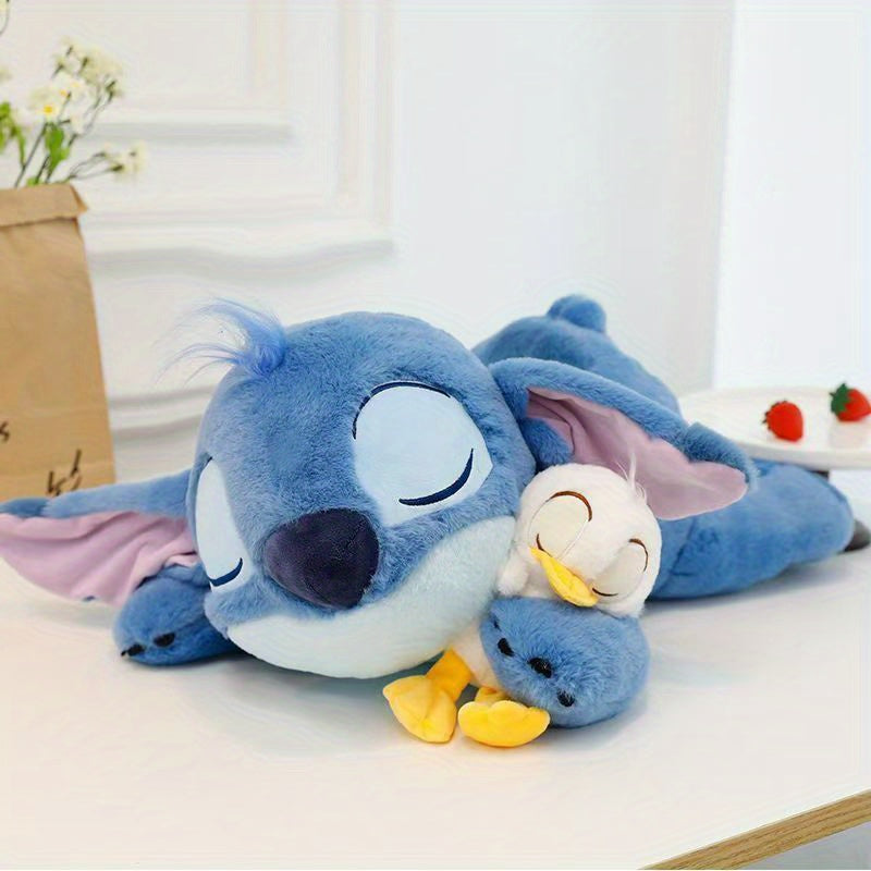 Jouet en Peluche Stitch avec Canard - Animal en Peluche Doux de Couleur Bleue dans une Position d'Étreinte, Coussin Officiellement Licencié pour Enfants, Filles, Femmes, Cadeau d'Anniversaire, Peluches Rembourrées